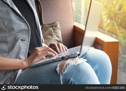 Female use Laptop in cafe. Student Researching Process Work.Young Business Woman Working Creative Startup modern Office. New strategy, Analyze market stock. Cropped