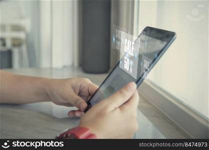 Female using smartphone shopping online with popup notification sale 50  , woman using mobile digital online and social media have a promotion sale on phone screen