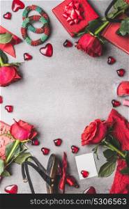 Female Valentines day or Dating accessories and Love symbol in red color: shoes,bracelets, gift,Jewelry, roses flowers, candles, crown and blank card with heart on gray background, top view, frame