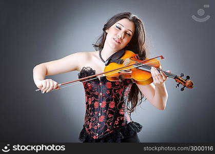 Female violin player against background