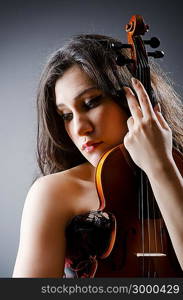 Female violin player against background