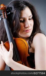 Female violin player against background