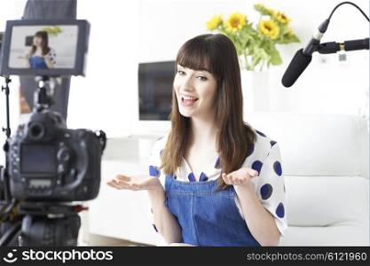 Female Vlogger Recording Broadcast At Home