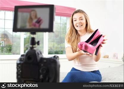 Female Vlogger Recording Broadcast In Bedroom