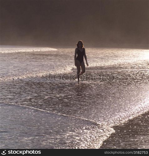 Female walking in the water in Costa Rica