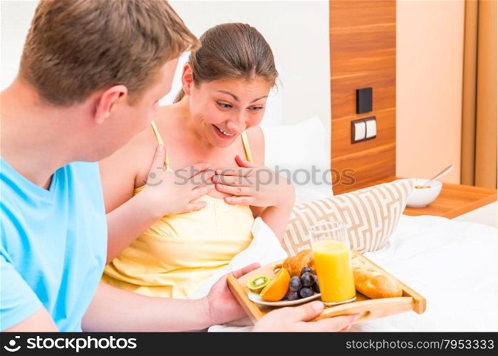 female was pleasantly surprised by breakfast in bed