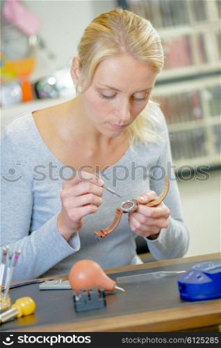 Female watch repairer