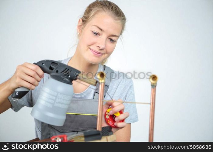 female welder in a metal shop