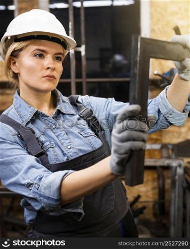 female welder work with helmet