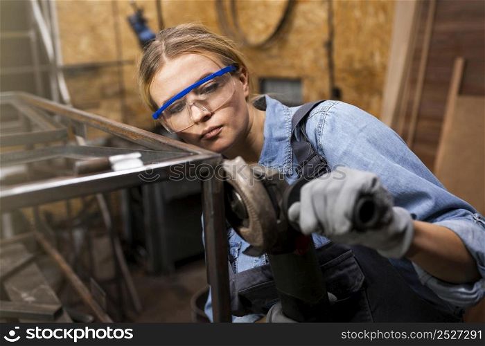 female welder working studio
