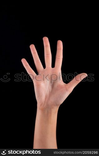 Female woman hand on the dark background. woman hand