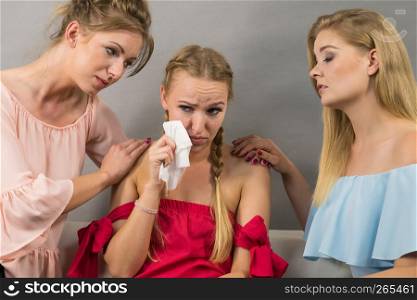 Female women comforting her woman sad friend helping her dealing with problems.. Friends helping sad woman