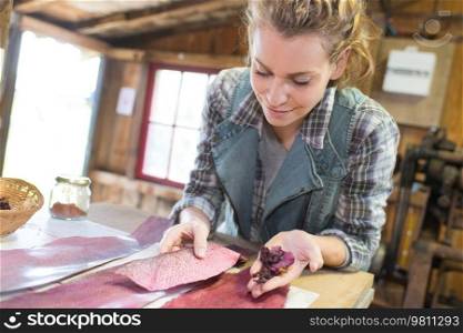 female woodworker wood sanding