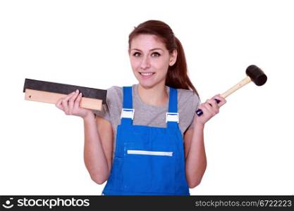 female worker holding hammer