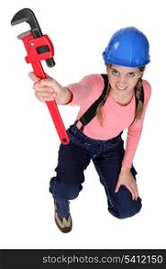 Female worker holding wrench