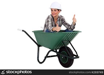 Female worker in a wheelbarrow