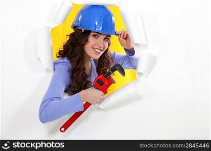 female worker watching us through a hole in a paper wall
