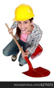 Female worker with a shovel