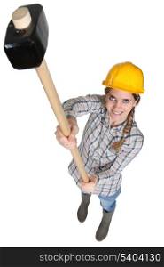 Female worker with a sledgehammer