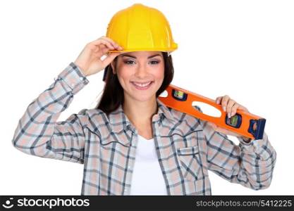 Female worker with a spirit level