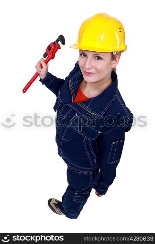 Female worker with a wrench