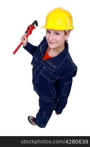 Female worker with a wrench