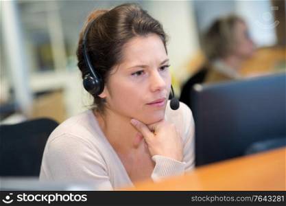 female worker with handset in office