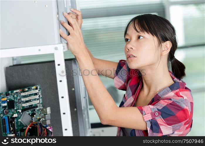 female working in electronic workshop