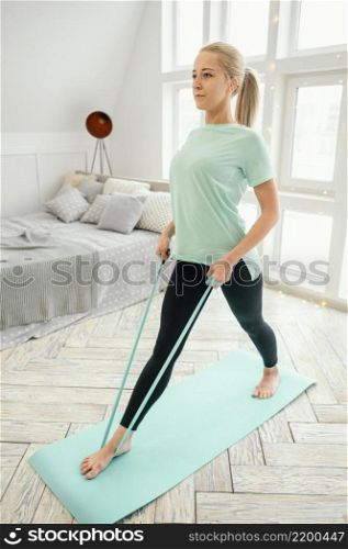 female working out mat with elastic band