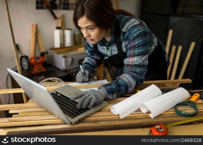 female working workshop using laptop