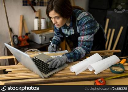 female working workshop using laptop