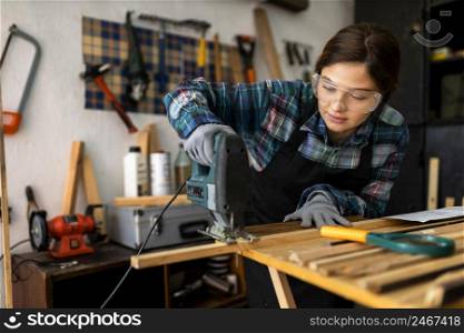 female working workshop with hammer drill 2