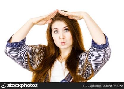 Feminine beauty concept. Portrait of beautiful young woman with long brown hair gesturing with hands. Portrait of beautiful young woman with brown hair