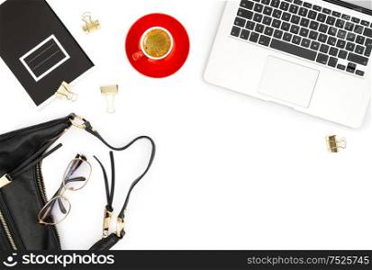 Feminine office desk. Laptop, coffee, books and on white background. Fashion flat lay for social media