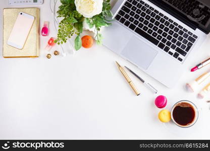 Feminine workspace border with keyboard, coffee and flowers, top view scene with copy space on desktop. Feminine workspace, top view