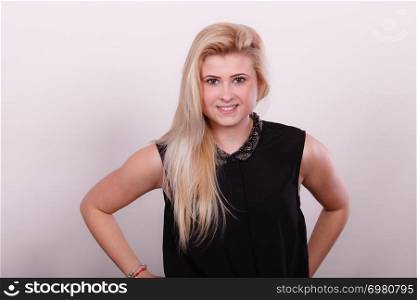 Feminity concept. Portrait of smiling, charming adult woman with long blonde hair.. Portrait of happy blonde, charming woman