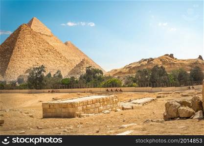 Fence around the great pyramids in Cairo desert, Egypt. Fence around pyramids