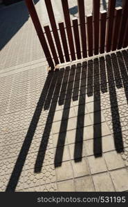 fence shadow silhouette on the ground in the street