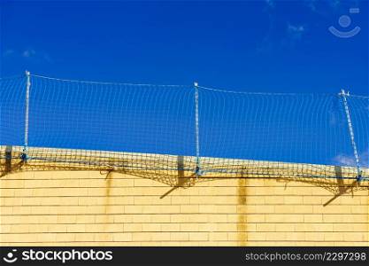 Fencing installed on roof of a house. Security mesh. Fencing installed on roof of a house.