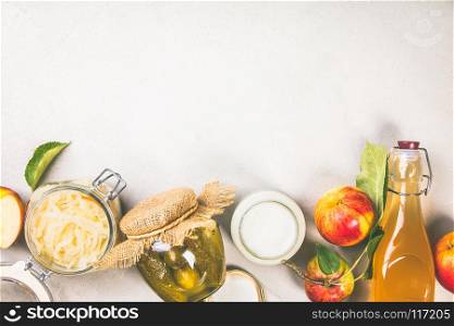Fermented food, probiotic sources - cucumber pickles, coconut milk yogurt, apple cider vinegar and sauerkraut - copyspace, flat lay