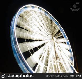 Ferris observation wheel in Poland Gdansk Old Town, night view.