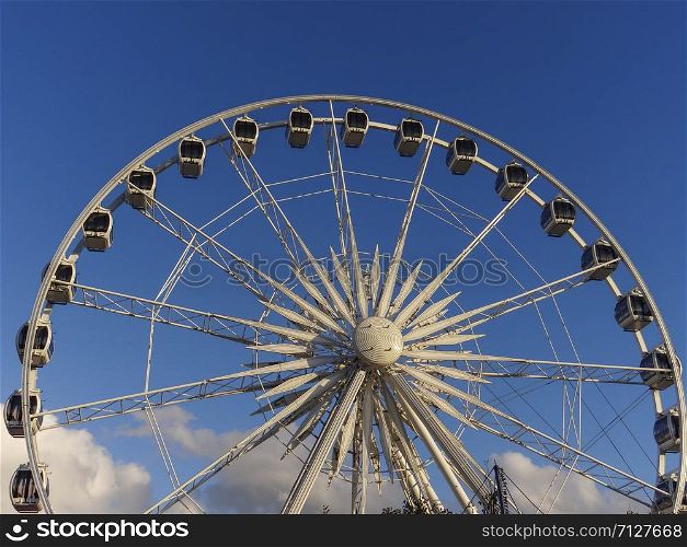 Ferris wheel and clouds blue sky