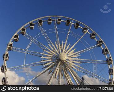 Ferris wheel and clouds blue sky