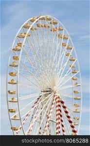 Ferris wheel at an amusement park with blue sky