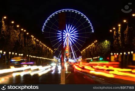 Ferris wheel at Champs Elysee in Paris at night, France