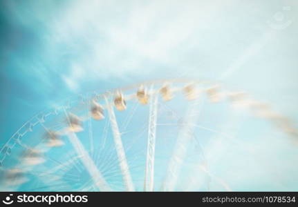 ferris wheel blue sky background. Double exposure