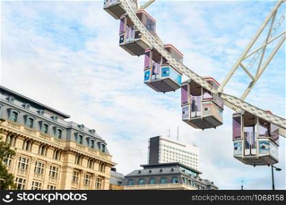 Ferris wheel cabins and downtown architecture of Brussels skywards, Belgium