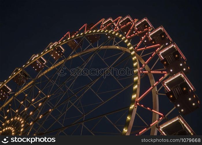 Ferris wheel in a night park. entertainment in the park
