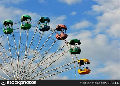 Ferris wheel in a summer amusement park