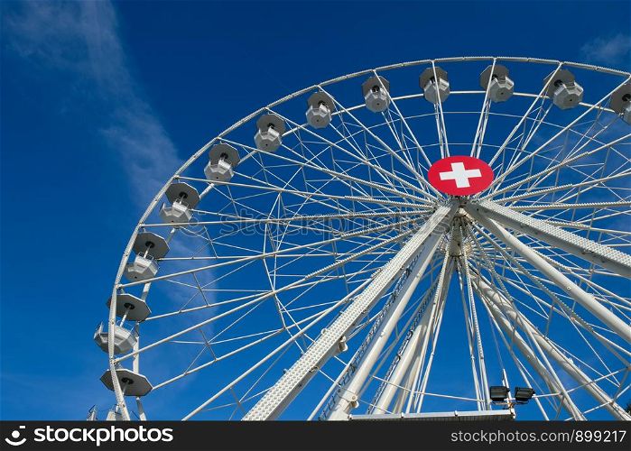Ferris wheel in Switzerland, Geneva on a sunny day